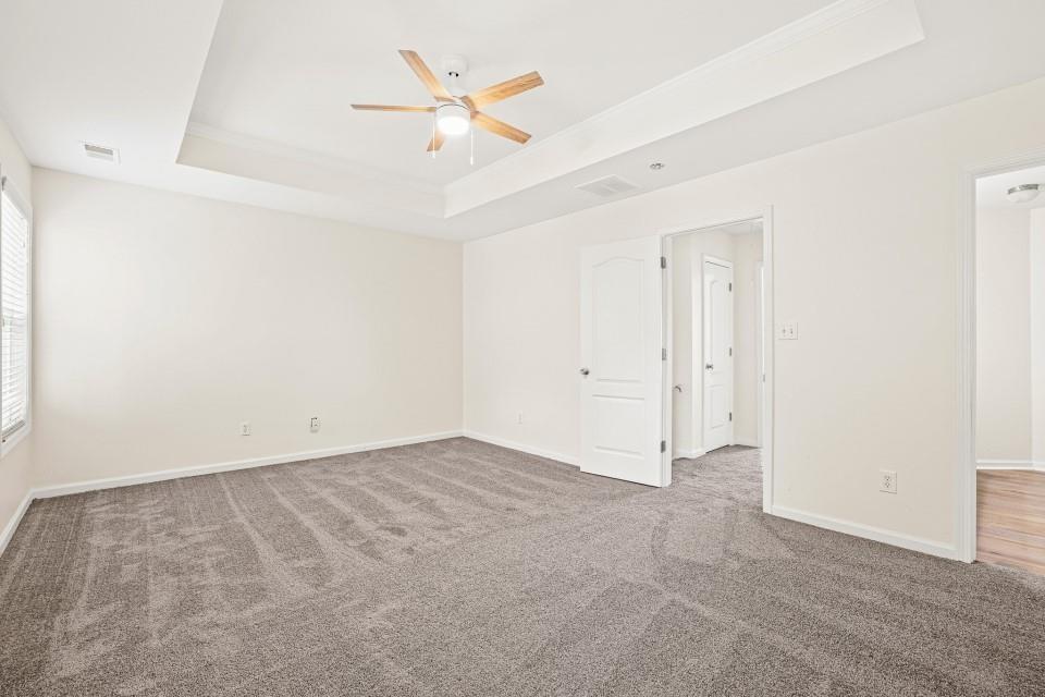 810 Ash Street Canton, GA 30114 - Photo 12 of 16 an empty room with a ceiling fan and a window