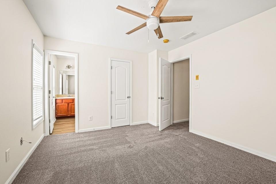 810 Ash Street Canton, GA 30114 - Photo 15 of 16 a view of a livingroom with a ceiling fan and window