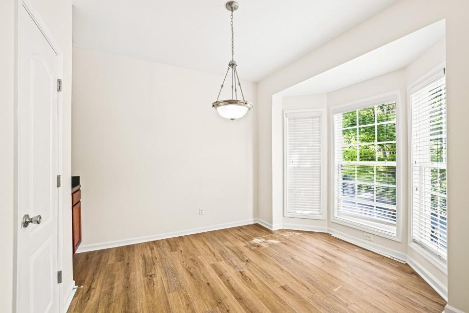810 Ash Street Canton, GA 30114 - Photo 7 of 16 a view of a room with wooden floor and windows