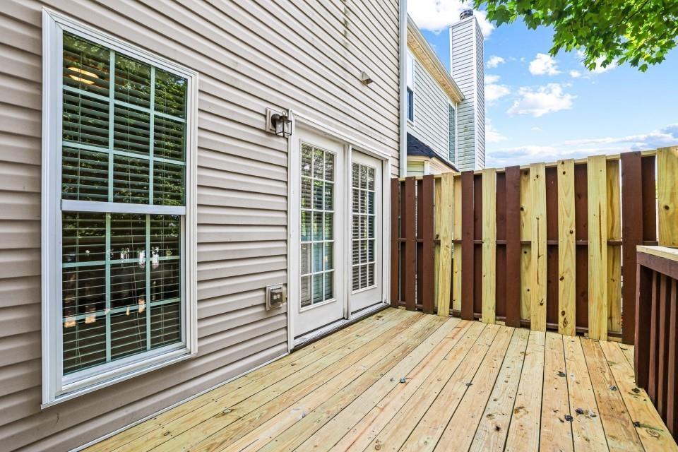 810 Ash Street Canton, GA 30114 - Photo 10 of 16 a view of a house with a wooden deck