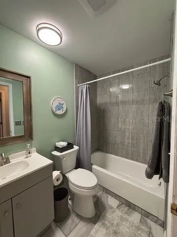 a bathroom with a toilet a sink and a bathtub