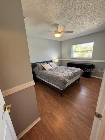 a bedroom with bed and window