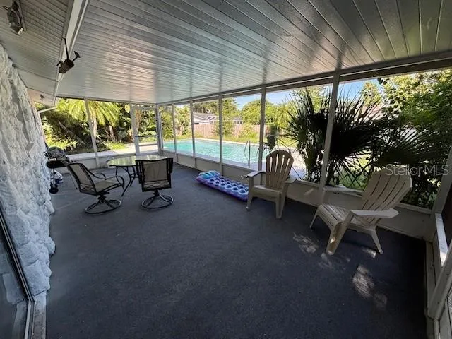 a balcony with furniture and a garden