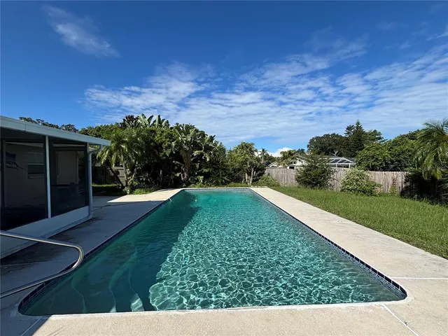 a view of a back yard of the house