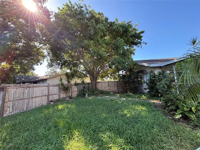 a view of a backyard with a small cabin