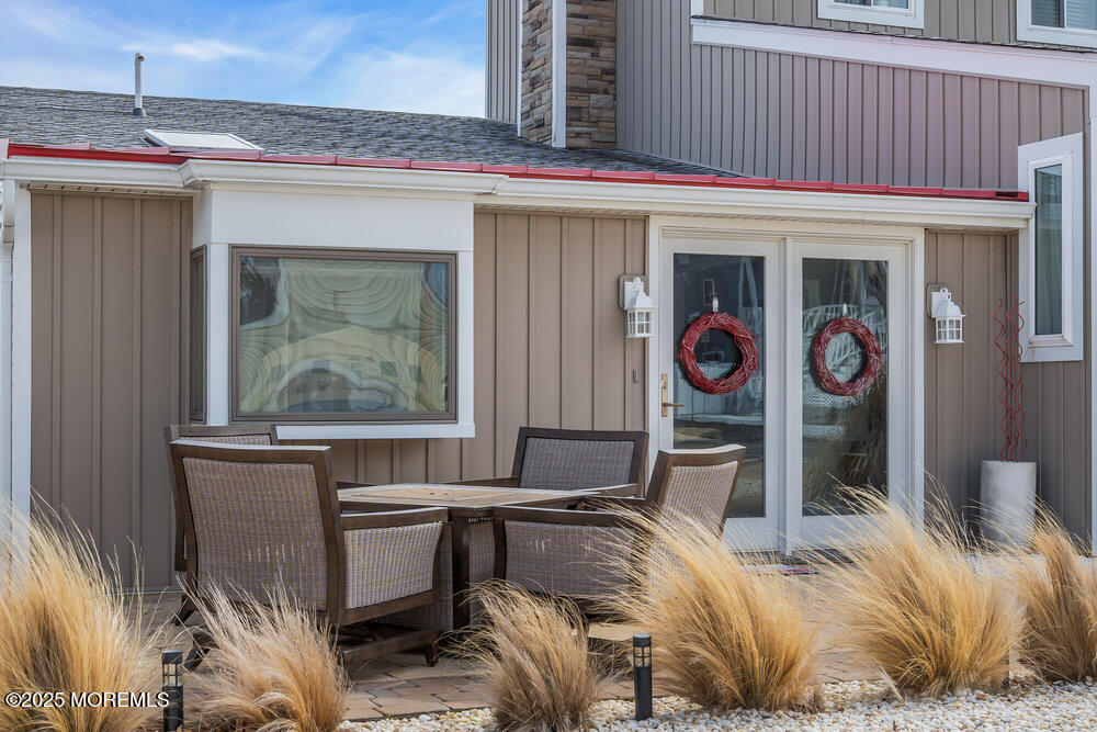 1604 Beach Boulevard Forked River, NJ 08731 - Photo 12 of 108 a bed sitting in a bedroom next to a window