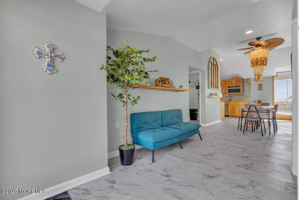 1604 Beach Boulevard Forked River, NJ 08731 - Photo 16 of 108 a living room with furniture and a table
