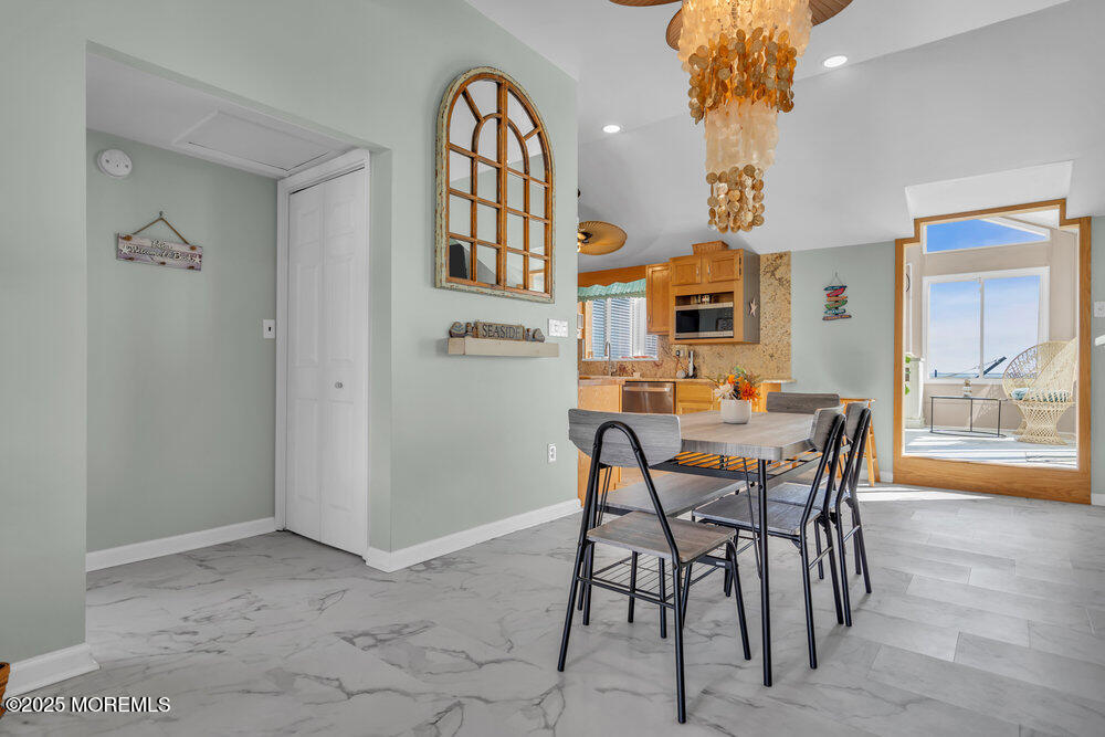 1604 Beach Boulevard Forked River, NJ 08731 - Photo 17 of 108 a view of a dining room with furniture and a chandelier
