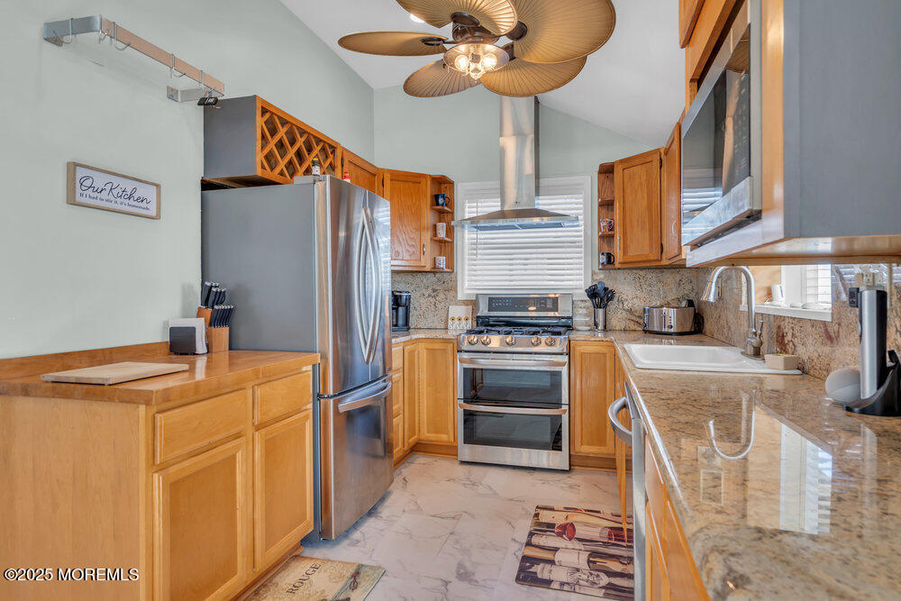 1604 Beach Boulevard Forked River, NJ 08731 - Photo 25 of 108 a kitchen with stainless steel appliances granite countertop a refrigerator a stove and a sink