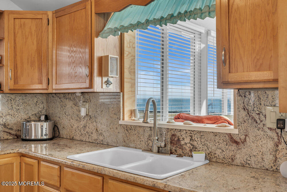 1604 Beach Boulevard Forked River, NJ 08731 - Photo 26 of 108 a bathroom with a sink and a mirror