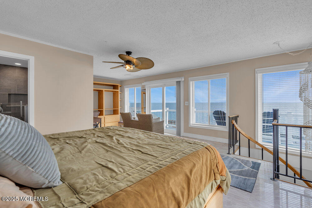 1604 Beach Boulevard Forked River, NJ 08731 - Photo 3 of 108 a bedroom with a bed and a chandelier