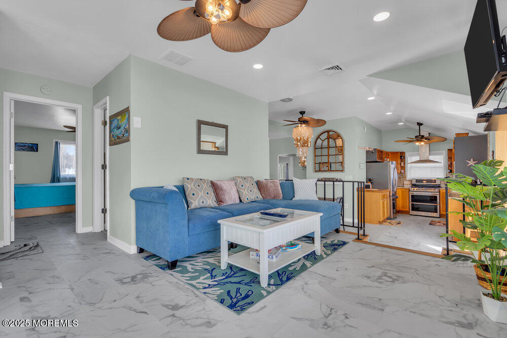 1604 Beach Boulevard Forked River, NJ 08731 - Photo 37 of 108 a living room with furniture and a flat screen tv