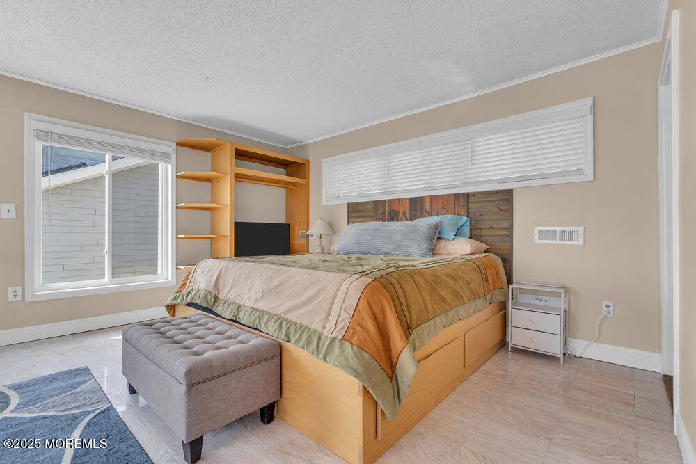 1604 Beach Boulevard Forked River, NJ 08731 - Photo 62 of 108 a bedroom with bed and window