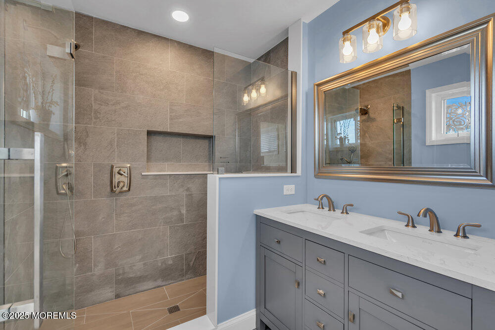 1604 Beach Boulevard Forked River, NJ 08731 - Photo 66 of 108 a bathroom with a granite countertop sink mirror and double