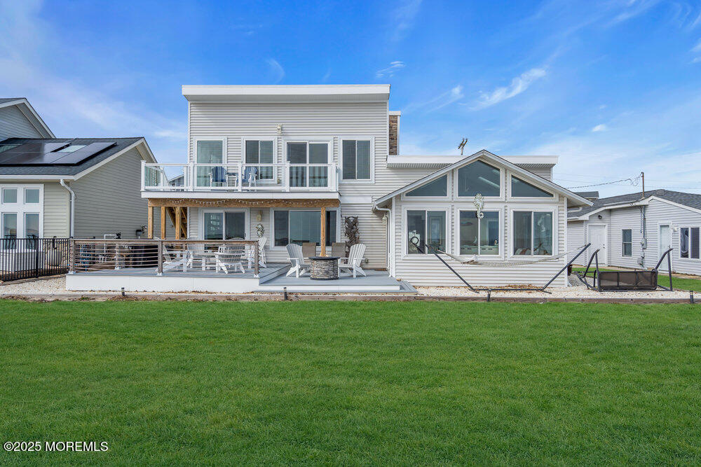 1604 Beach Boulevard Forked River, NJ 08731 - Photo 84 of 108 a front view of a house with a yard table and chairs