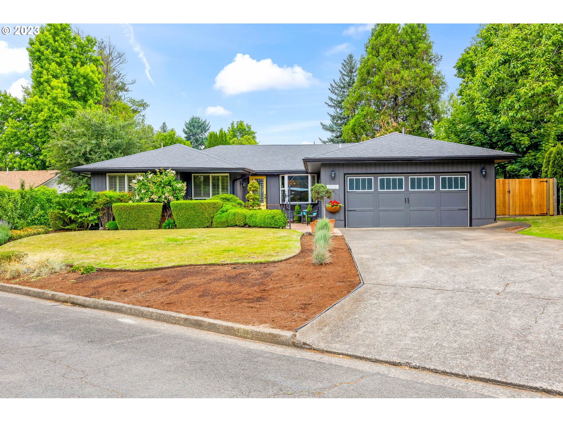 a view of house with yard and entertaining space