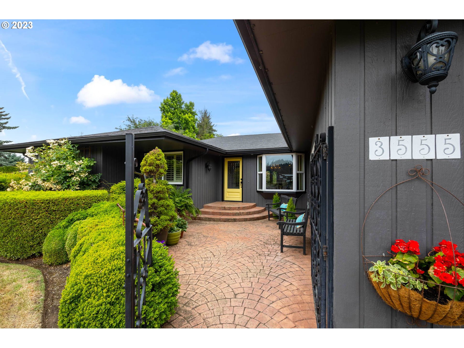 3555 Bardell Avenue Eugene, OR 97401 - Photo 2 of 31 a view of a house with a porch and garden
