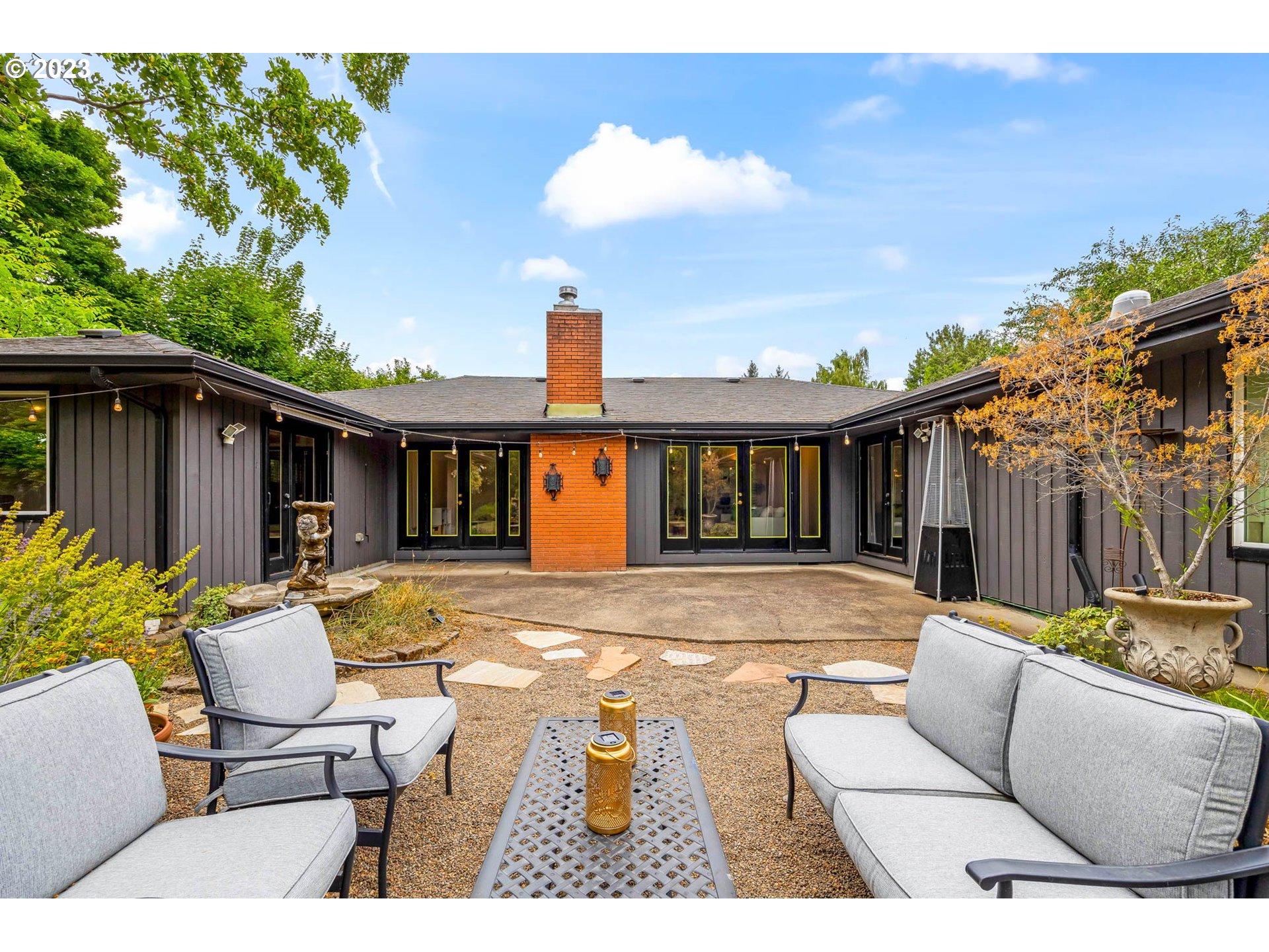 3555 Bardell Avenue Eugene, OR 97401 - Photo 26 of 31 a view of a house with backyard outdoor seating area and furniture