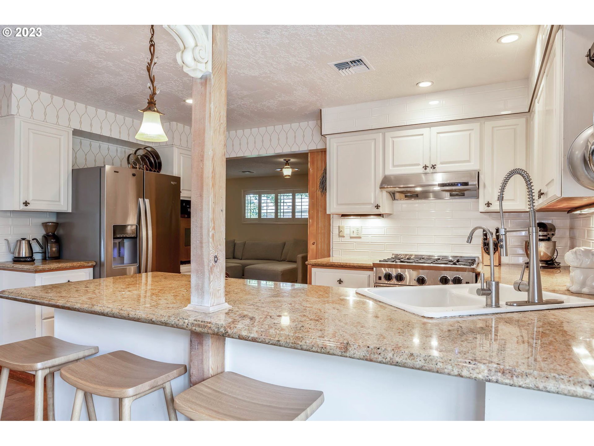 3555 Bardell Avenue Eugene, OR 97401 - Photo 6 of 31 a kitchen with stainless steel appliances granite countertop a sink refrigerator and cabinets