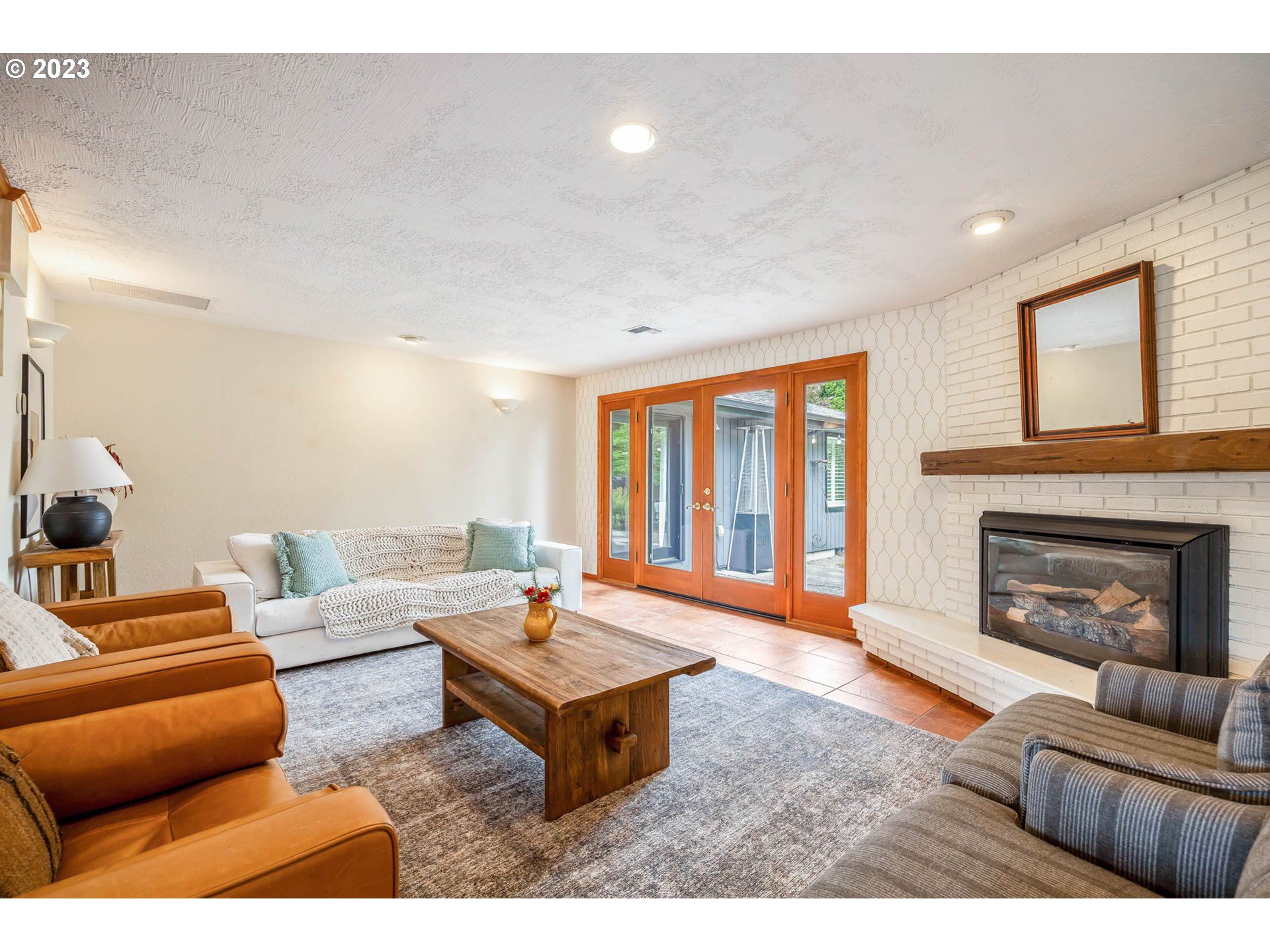 3555 Bardell Avenue Eugene, OR 97401 - Photo 8 of 31 a living room with furniture and a fireplace