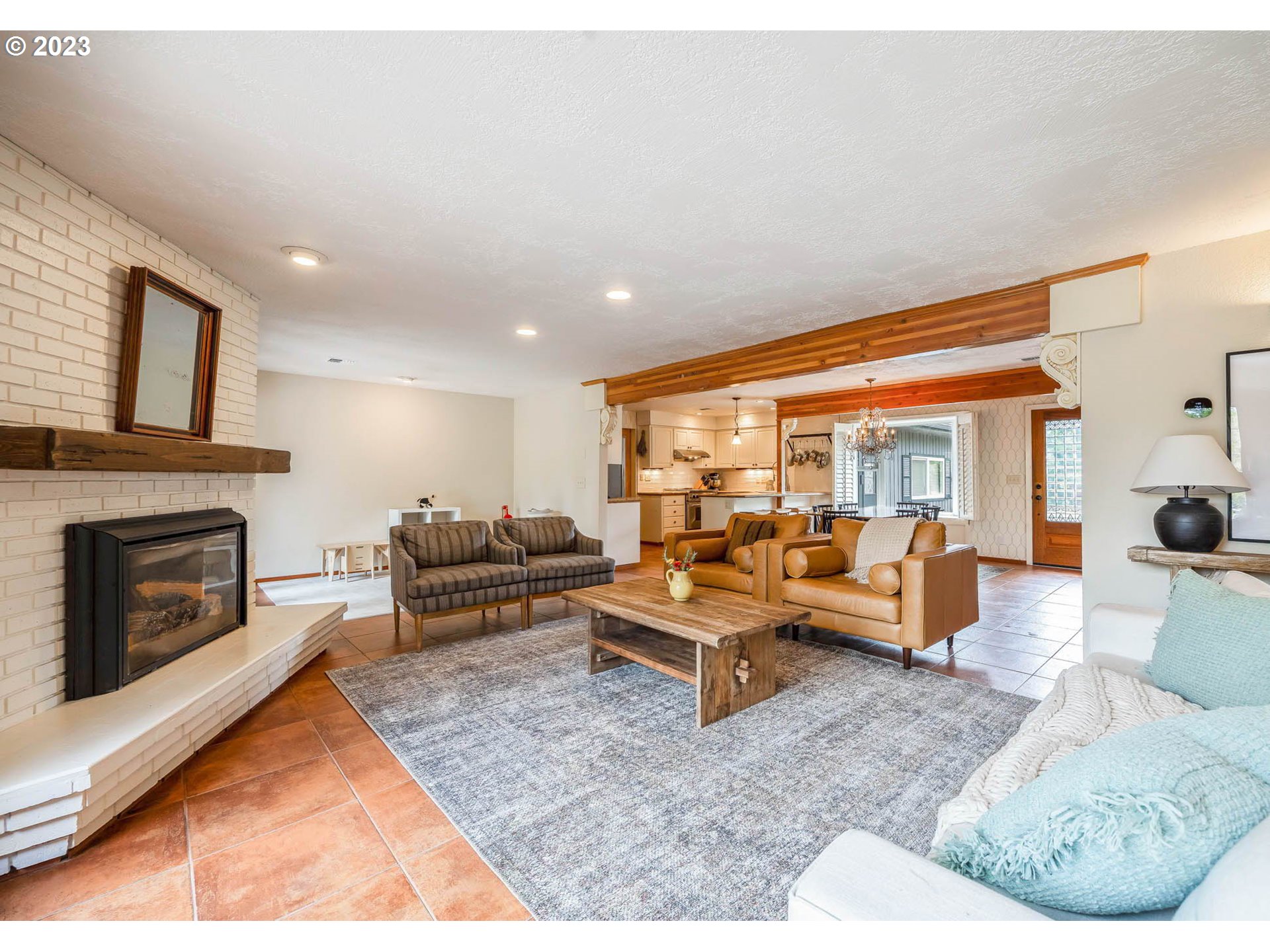 3555 Bardell Avenue Eugene, OR 97401 - Photo 9 of 31 a living room with furniture large window and a fireplace