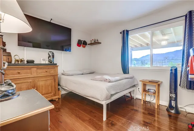 a bathroom with a granite countertop sink a toilet and a mirror