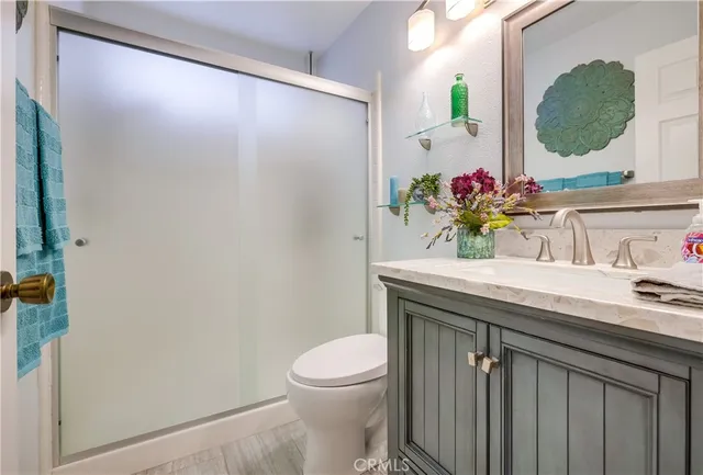 a view of hallway with wooden floor and table