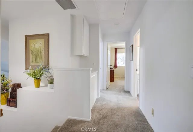 a bed sitting in a room next to a window