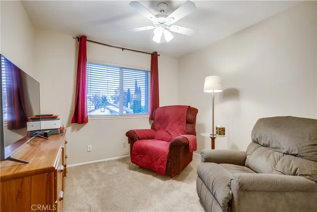a bathroom with a sink toilet and window