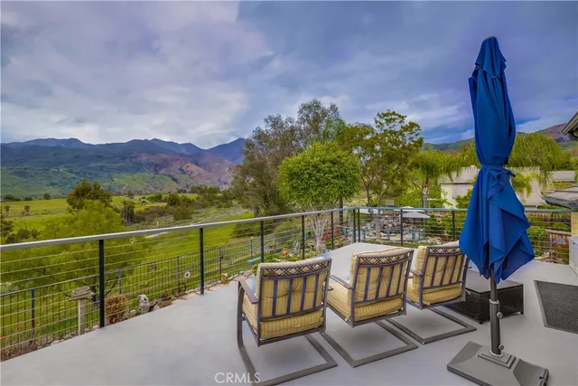 an aerial view of a house with a swimming pool