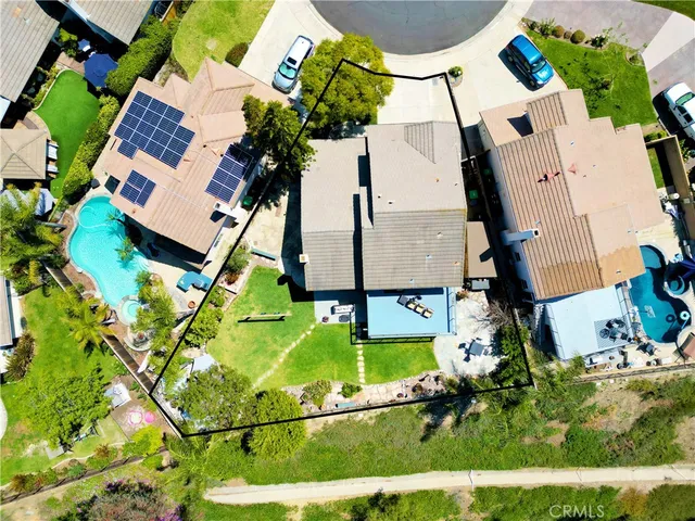 a front view of a house with swimming pool having outdoor seating