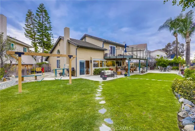 an outdoor space with furniture and umbrella