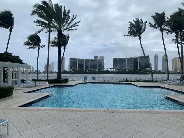 a view of ocean view with palm trees