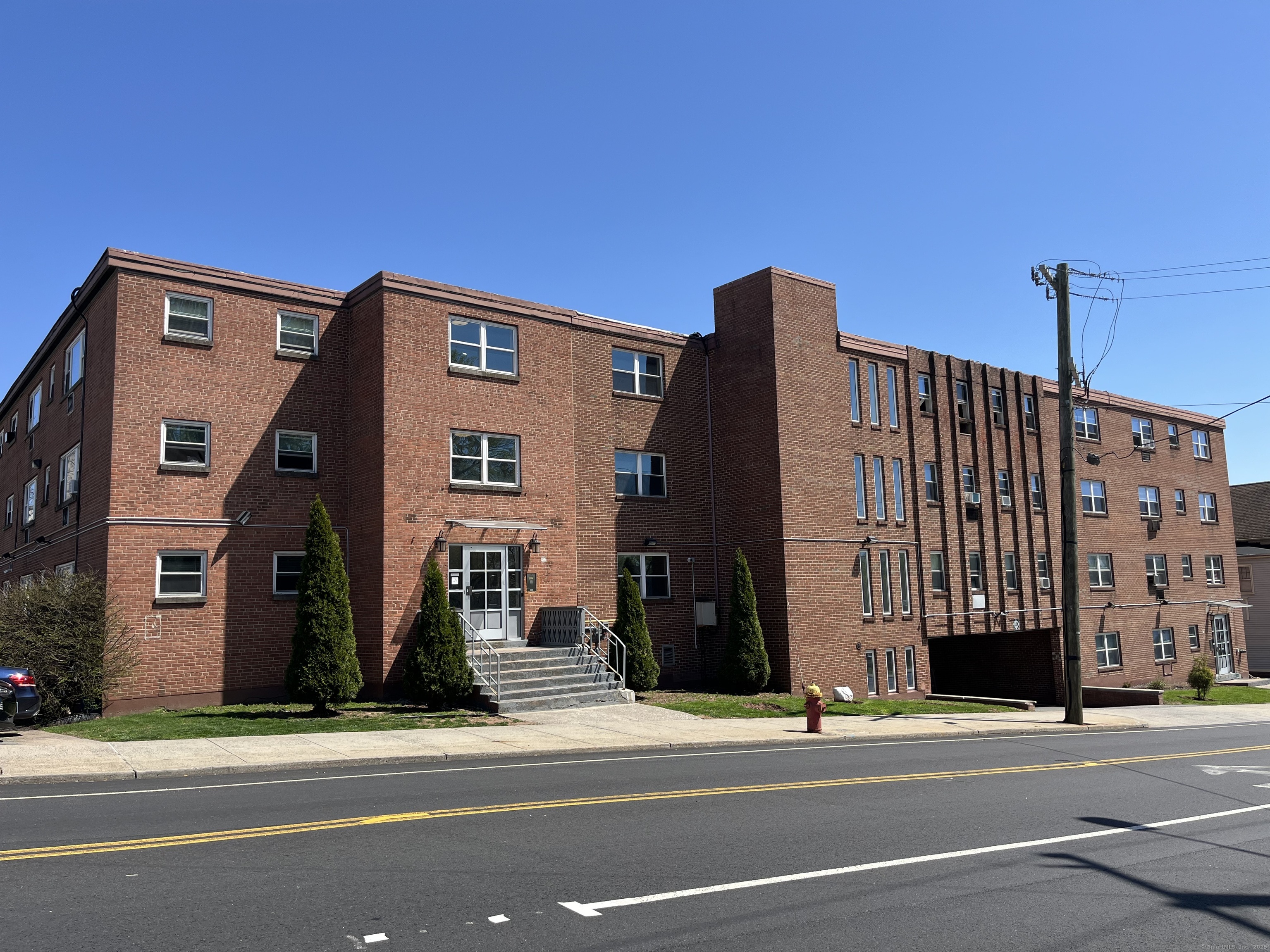 32 Cook Avenue, Unit 306 Meriden, CT 06451 - Photo 1 of 9 a view of a building and a street