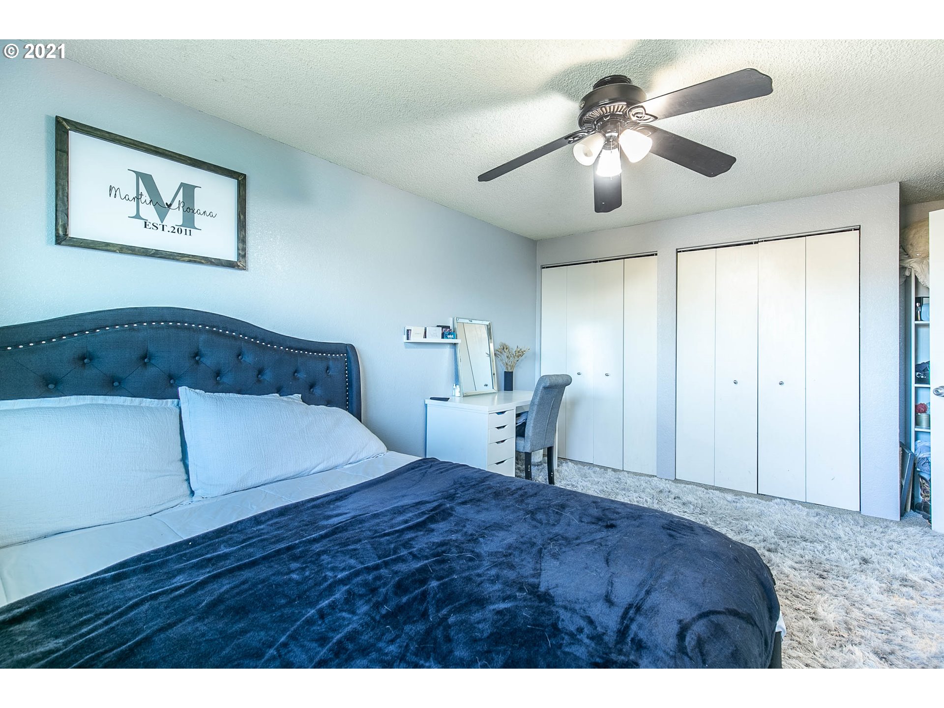 168 North 38th Place Springfield, OR 97478 - Photo 11 of 19 a bedroom with a bed and a chandelier