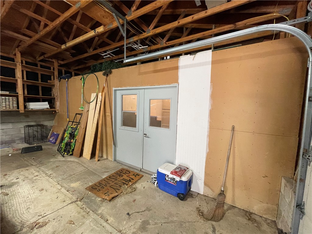 360 Ridge Street Piqua, OH 45356 - Photo 36 of 46 This functional garage features exposed ceiling joists and practical storage solutions.