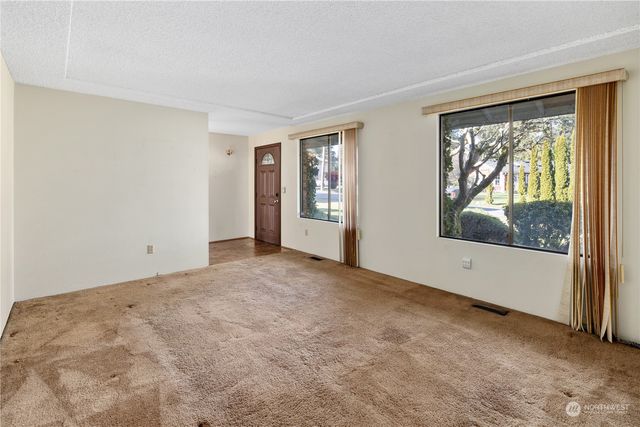 a living room with furniture fireplace and flat screen tv