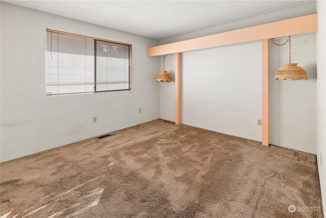 an empty room with a mirror