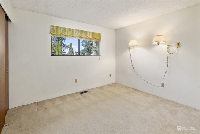 a view of a lush green forest with a houses