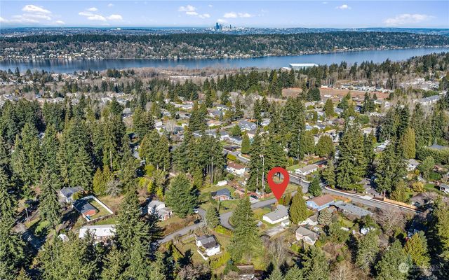 a view of a chair and table in backyard of the house