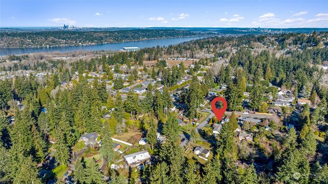 a view of a house with a yard and garage