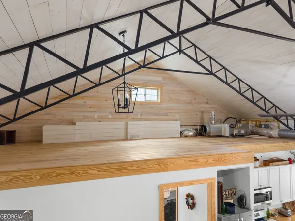 a view of a white house with a yard