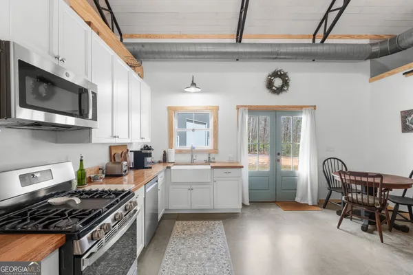 a dining room with furniture and window