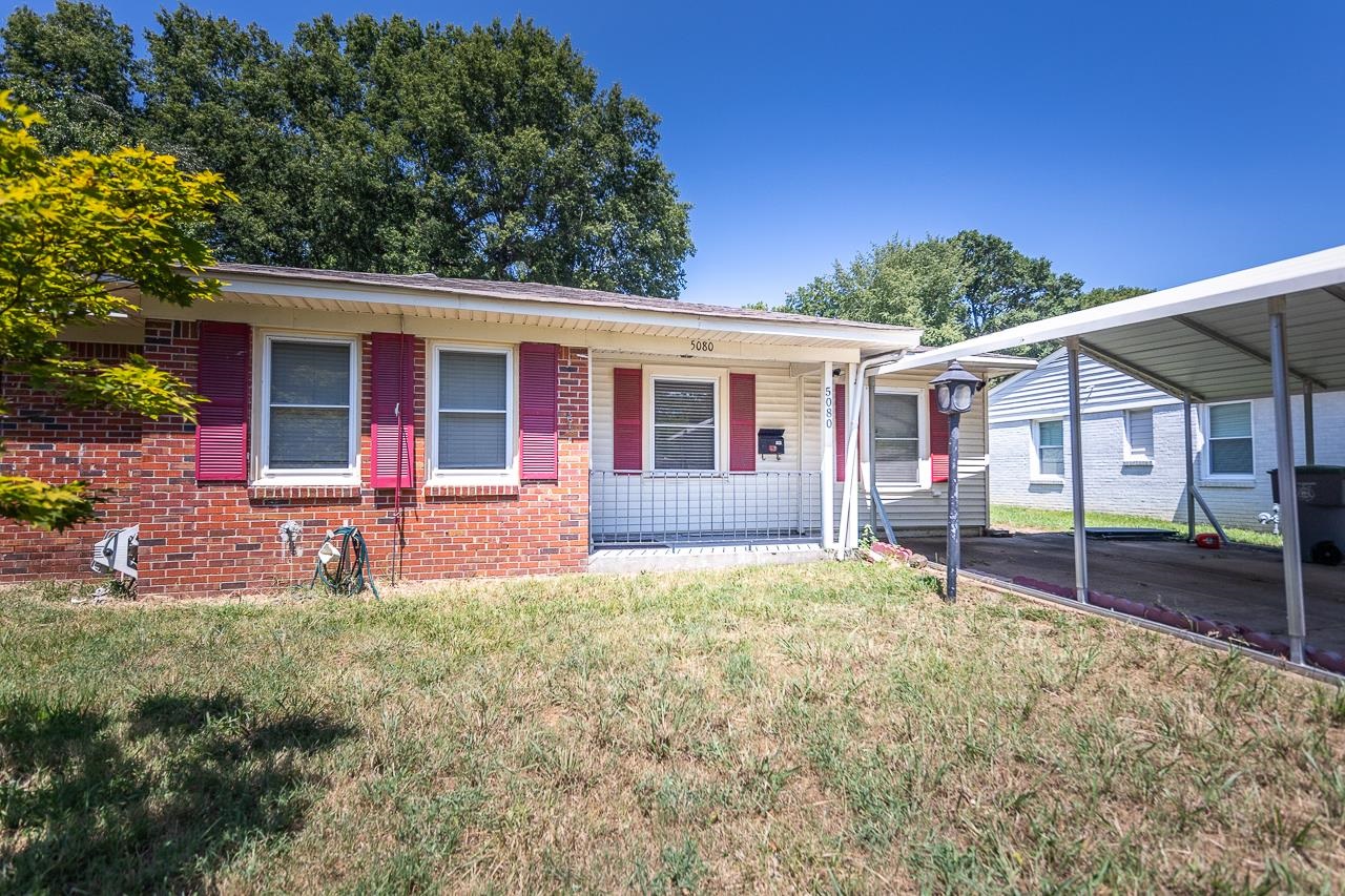 5080 Sea Isle Road Memphis, TN 38117 - Photo 1 of 21 front view of a house with a yard