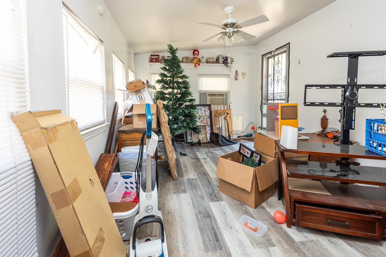 5080 Sea Isle Road Memphis, TN 38117 - Photo 15 of 21 a living room with furniture and a flat screen tv
