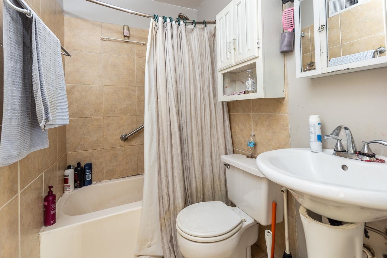 5080 Sea Isle Road Memphis, TN 38117 - Photo 20 of 21 a white toilet sitting next to a bathroom sink