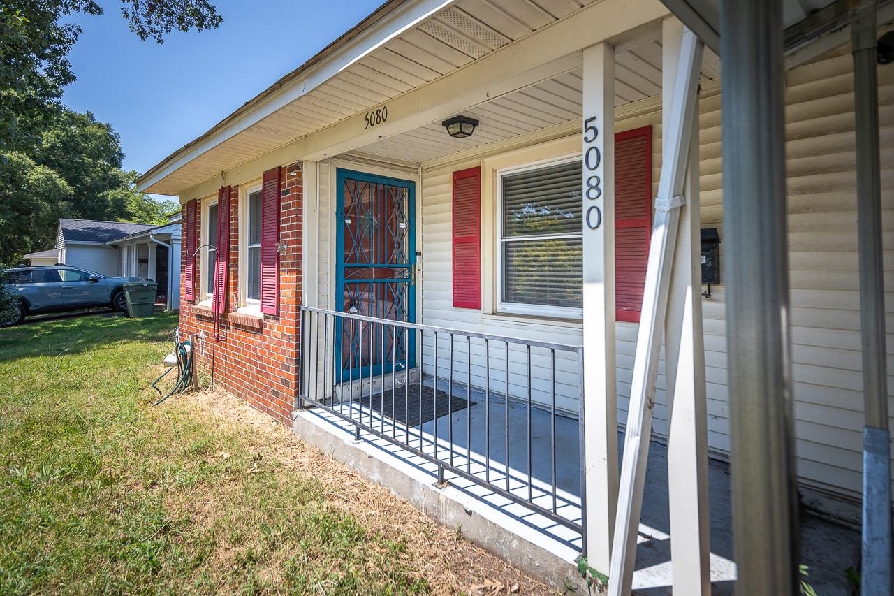 5080 Sea Isle Road Memphis, TN 38117 - Photo 2 of 21 a view of a house with a porch and wooden floor