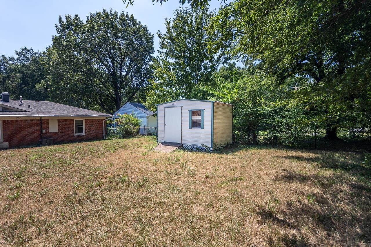 5080 Sea Isle Road Memphis, TN 38117 - Photo 9 of 21 a house with trees in front of it