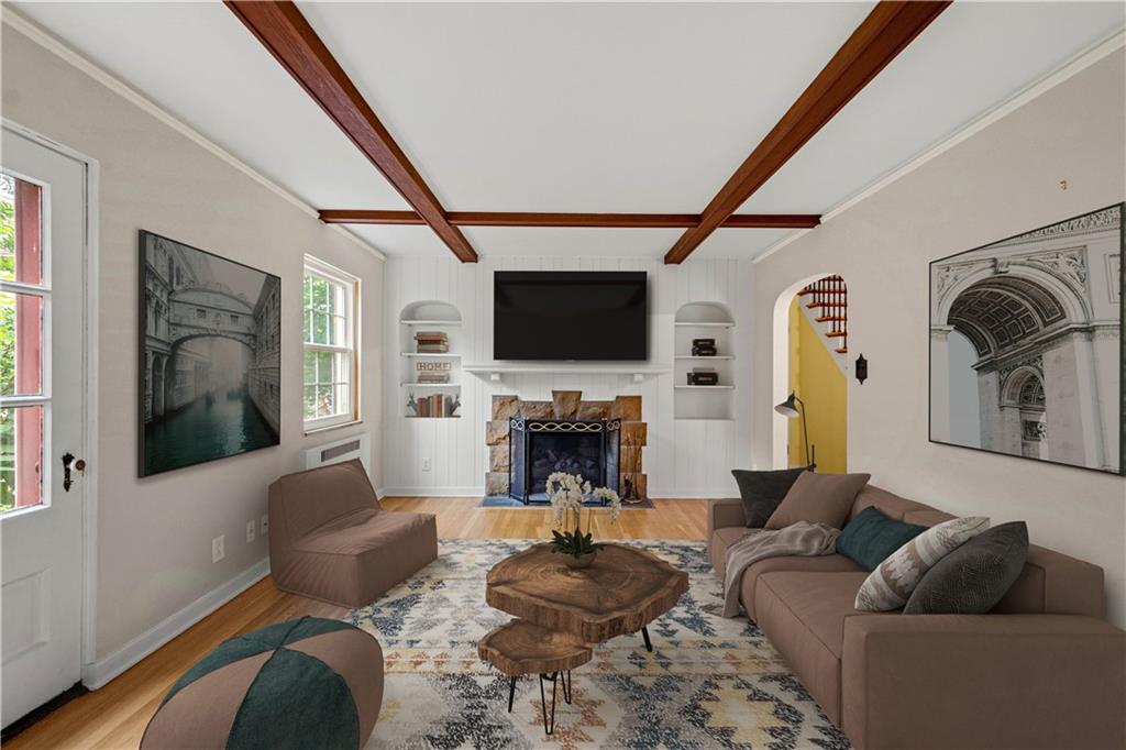 4520 Norwin Road Pittsburgh, PA 15236 - Photo 11 of 31 a living room with fireplace furniture and a flat screen tv
