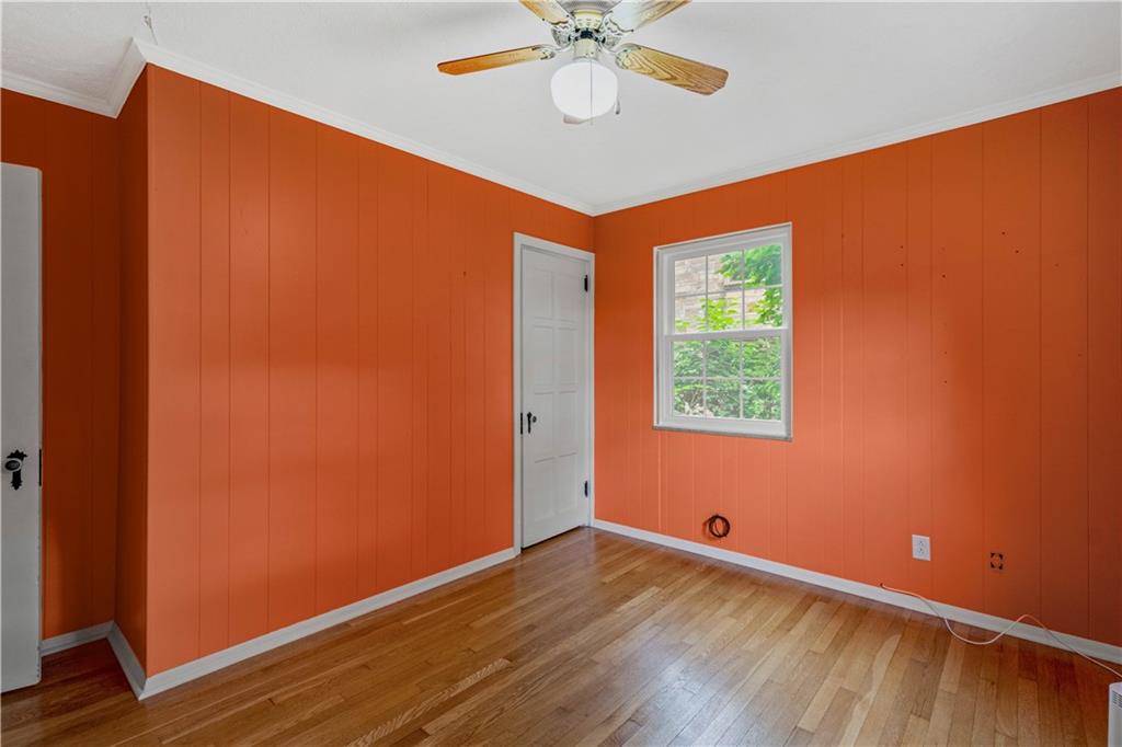 4520 Norwin Road Pittsburgh, PA 15236 - Photo 14 of 31 an empty room with wooden floor and windows